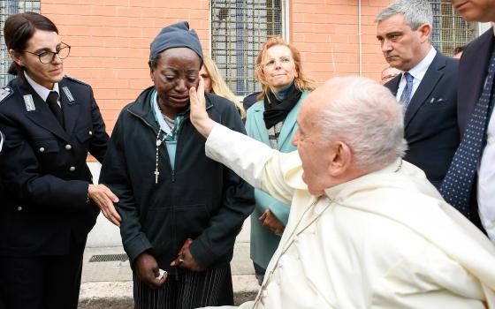 Pope Francis comforts inmate