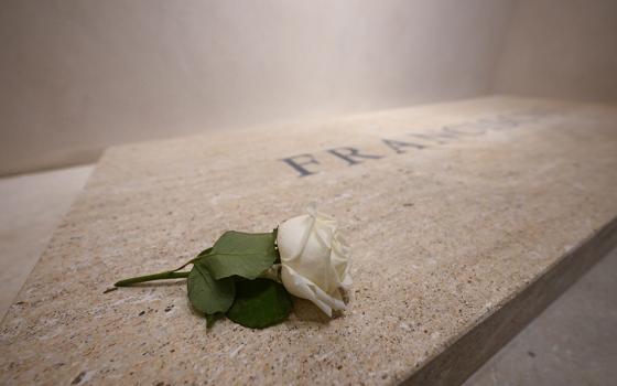 A single white rose sits on the tomb of Pope Francis in Rome's Basilica of St. Mary Major early on April 27, 2025. (CNS/Vatican Media)