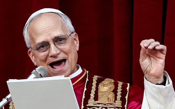 Pope Leo XIV speaks on the central balcony of St. Peter's Basilica at the Vatican May 8, 2025, following his election during the conclave. (OSV News/Reuters/Yara Nardi)