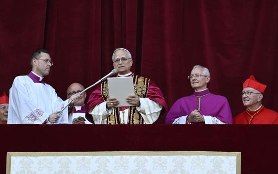 Pope Leo XIV, the former Cardinal Robert Prevost, waves to the crowds in St. Peter's Square at the Vatican after his election as pope May 8, 2025. The new pope was born in Chicago. (CNS/Vatican Media)