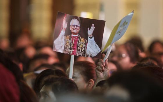 Someone holds a placard with an image of Pope Leo XIV on the day of a Mass at the Cathedral of Santa Maria de Chiclayo in Peru May 10, 2025, celebrating the election of Pope Leo XIV May 8 at the Vatican. The new pope was bishop of Chiclayo between 2015 and 2023. (OSV News/Reuters/Sebastian Castaneda)