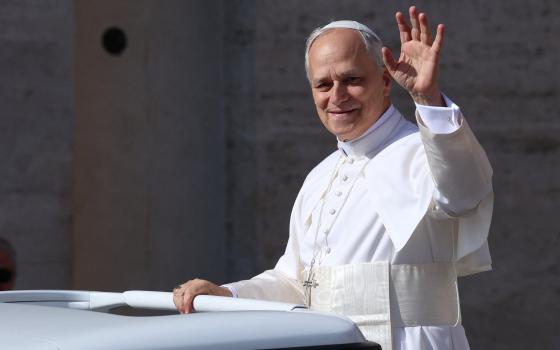 Pope Leo XIV, formerly Cardinal Robert Francis Prevost, waves as he arrives to celebrate his inauguration Mass at the Vatican May 18, 2025. He is the first American pope in history. (OSV News photo/Claudia Greco, Reuters)