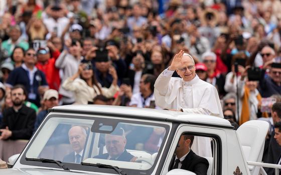 Pope Leo XIV rides through St. Peter's Square at the Vatican May 21, 2025, before holding his first weekly general audience. (CNS/Lola Gomez)
