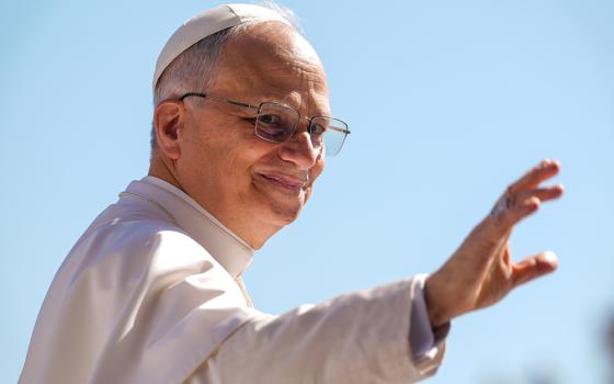 Pope Leo XIV waves as he rides the popemobile around St. Peter’s Square at the Vatican May 28, 2025, ahead of his second weekly general audience. (CNS/Lola Gomez)