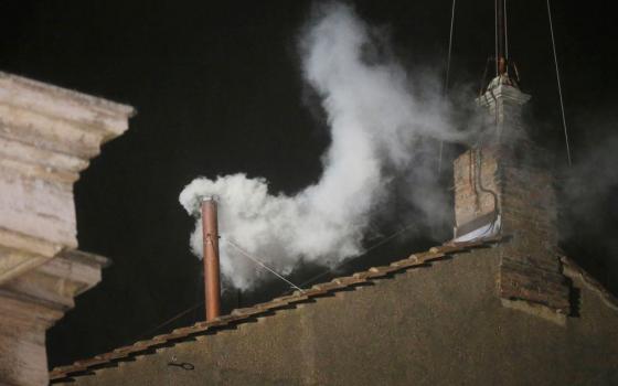White smoke billows from the chimney of the Sistine Chapel, announcing that a new pope had been elected, Wednesday, March 13, 2013. The new pope, Jorge Mario Bergoglio of Argentina, took the name Francis. (AP/Gregorio Borgia, File)