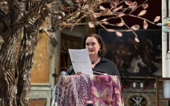 Miriam Duignan Wijngaards prays at an event supporting women's ordination at Rome’s Oratory of San Francesco Saverio del Caravita May 6, the evening before the conclave to elect a new pope begins. (NCR photo/Rhina Guidos)