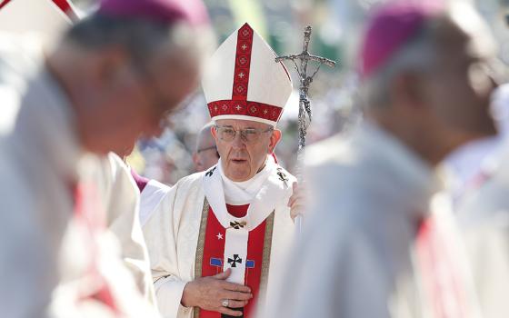 Pope Francis arrives in procession with other bishops during Mass at the Maquehue Airport near Temuco, Chile, Jan. 17, 2018. (CNS/Paul Haring)