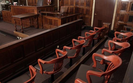 A jury box, judge's chair and witness stand are seen in this courtroom illustration photo. A federal jury in New Orleans has ordered the Holy Cross order to pay nearly $2.4 million in damages to a man who reported being sexually abused by one of its members in the late 1960s. (OSV News/Reuters/Chip East)