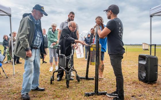 Retired Bishop Felipe J. Estévez of St. Augustine, Fla., joins people from across Florida for a prayer vigil outside Florida State Prison in Raiford on Feb. 13, 2025.