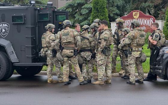 Police deploy as a manhunt is underway for a shooter that targeted two state lawmakers, in Brooklyn Park, Minn. on June 14. Minnesota State Rep. Melissa Hortman and her husband were shot and killed;  State Sen. John Hoffman and his wife were each shot multiple times and underwent surgery at a hospital. (AP/Tim Sullivan)