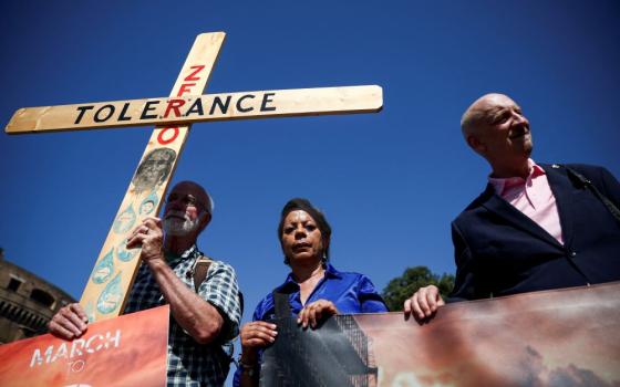 Advocates for zero tolerence of clergy sexual abuse including Tim Law, left, Denise Buchanan and Peter Isely attend a march with survivors of clergy sexual abuse and activists near the Vatican in Rome Sept. 27, 2023. (OSV News/Reuters/Guglielmo Mangiapane)