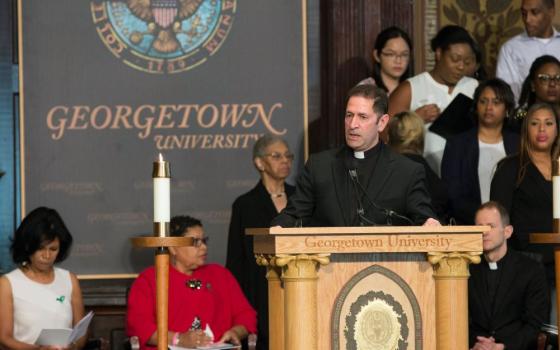 Jesuit Fr. Timothy Kesicki, president of the Jesuit Conference of Canada and the United States, speaks at an April 18 "Liturgy of Remembrance, Contrition and Hope" in Gaston Hall on the campus of Georgetown University in Washington. (CNS/Catholic Standard/Jaclyn Lippelmann) 