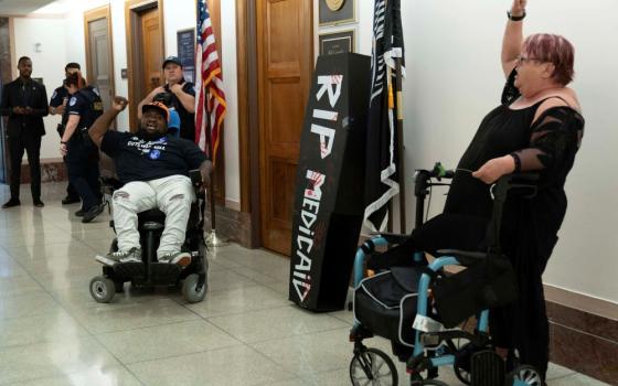 Demonstrators on wheelchairs protest outside the office of Sen. Bill Cassidy, Republican of Louisiana, regarding the proposed cuts to Medicaid, on Capitol Hill in Washington, June 11, 2025. (AP/Jose Luis Magana)