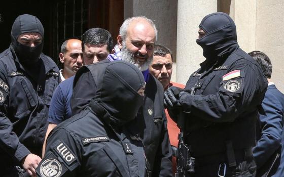 Armenia's National Security officers arrest Archbishop Bagrat Galstanyan of the Armenian Apostolic Church  in Yerevan, Armenia, June 25. Galstanyan is charged with attempting to overthrow the government and destabilizing the state. (OSV News/Reuters/Melik Baghdasaryan)