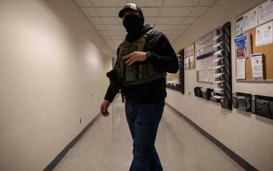 A federal agent walks around at the immigration court at Jacob K. Javits Federal Building in New York, June 9, 2025. (AP/Yuki Iwamura)
