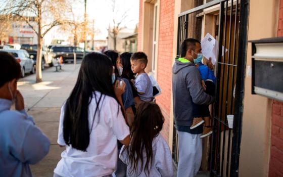 A migrant family is dropped off Dec. 13, 2022, at a migrant shelter run by the Annunciation House in downtown El Paso, Texas. The Texas Supreme Court has overturned a lower court ruling, allowing Texas Attorney General Ken Paxton to move forward with his investigation into Annunciation House. (OSV News/Reuters/Ivan Pierre Aguirre)
