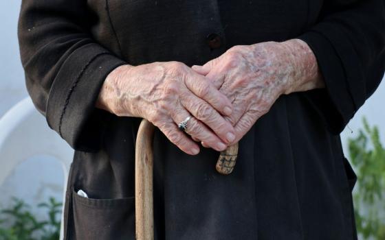 hands hold cane