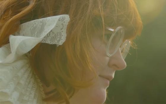 Raised Catholic, the musician Corook explores queerness and self-acceptance in their new album, "Committed to a Bit." (NCR screenshot/YouTube/hicorook)