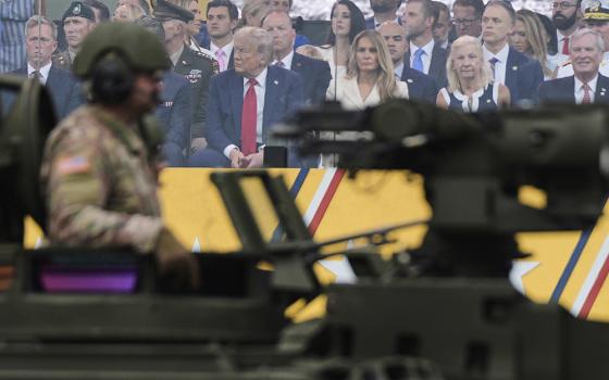 President Donald Trump attends a military parade commemorating the Army's 250th anniversary, coinciding with his 79th birthday, on June 14, 2025, in Washington. (AP Photo/Julia Demaree Nikhinson)
