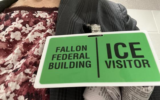 An ID badge for a visitor at George H. Fallon Federal Building in Baltimore, a check-in field office for the U.S. Immigrations and Customs Enforcement. (NCR photo/Patricia Zapor)