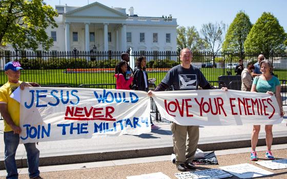 Art Laffin, center, of the Dorothy Day Catholic Worker, participates in a protest for peace with other demonstrators outside of the White House April 15, 2016. (CNS/Chaz Muth) 