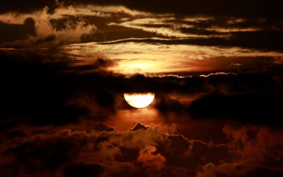 Rain clouds form during sunset in Kathmandu, Nepal, Aug. 31, 2020. Jesuit Fr. Francis X. Clooney's time in Nepal "fundamentally shaped the rest of his career," writes Greta Gaffin. (CNS/Reuters/Navesh Chitrakar)