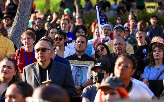 A member of the clergy holds an image of Our Lady of Guadalupe at a vigil in Grand Park in downtown Los Angeles June 10, 2025, as protests against federal immigration sweeps continue. (OSV News/Reuters/David Swanson)