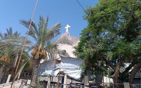 Damage can be seen next to the cross on the roof of the Holy Family Church in Gaza after it was hit in an attack July 17, 2025. At least three people died and another 10 were injured, including the parish priest, Father Gabriel Romanelli, who sustained a slight injury to his right leg. (CNS/Courtesy of Aid to the Church in Need, UK)