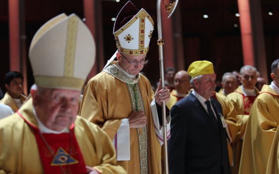 Archbishop Adrian Galbas of Warsaw, Poland, prays during Mass March 13, 2025, in Warsaw's Temple of Divine Providence. Archbishop Galbas in a July 25 statement said that he was "devastated and crushed" by the arrest of a diocesan priest in the brutal murder of a homeless man July 24 and the priest's confession to police he did it. (OSV News photo/courtesy Polish bishops' conference)
