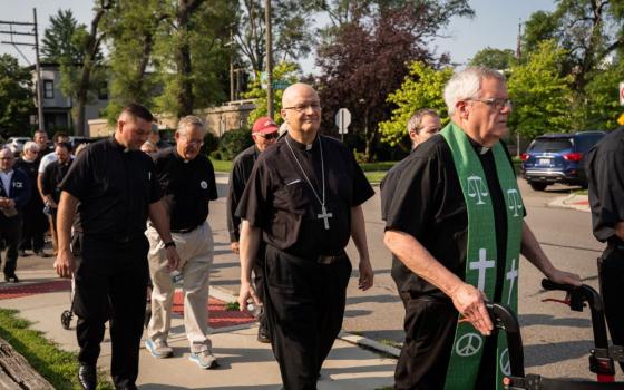 Detroit Archbishop Edward Weisenburger joins other clergy during a procession from Most Holy Trinity Church in Detroit's Corktown neighborhood to the ICE Regional Field Office on Michigan Avenue in downtown Detroit July 14. The procession was organized by Strangers No Longer, a Catholic immigrant rights advocacy group. (OSV News/Detroit Catholic/Valaurian Waller)