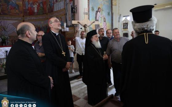 Fr. Gabriel Romanelli, parish priest of the Holy Family Church; Cardinal Pierbattista Pizzaballa, the Latin patriarch of Jerusalem; and Greek Orthodox Patriarch Theophilos III visit the Holy Family Church in Gaza City July 18. A day earlier, the Israeli army struck the church in an attack that killed three and injured others. (CNS/Courtesy Latin Patriarchate of Jerusalem)