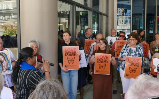People participate in a vigil for immigrants and refugees at the United Church of Christ General Synod in Kansas City, Mo., in July. (RNS/Courtesy of Abigail Cipparone)