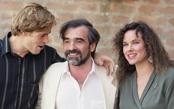 In this file photo dated Sept. 7, 1988, director Martin Scorsese, center, poses with the stars of his film, "The Last Temptation of Christ", actors Barbara Hershey, right, who plays Mary Magdalene, and William Dafoe who plays Christ, at the Venice Film Festival. The film released in 1988 in the face of denunciations from religious leaders. (AP photo, File)
