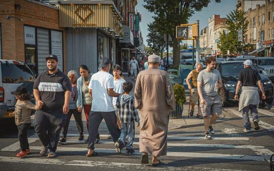 Pedestrians cross the street in the Bay Ridge neighborhood of Brooklyn, New York, June 5, 2025. (AP/Andres Kudacki)