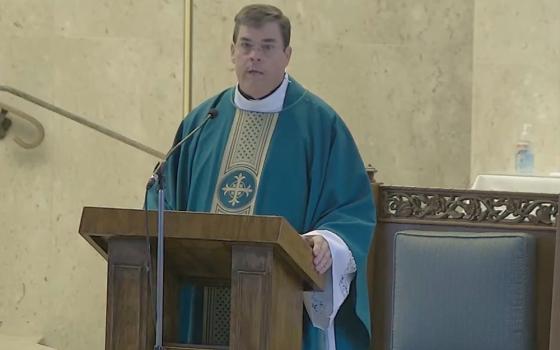 Fr. Robert Sullivan told his congregation he was taking a leave of absence on Aug. 3. (The Guardian/YouTube)