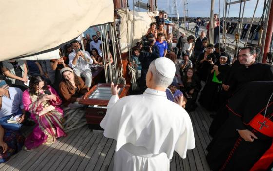 Pope Leo XIV speaks to young adults aboard the "Bel Espoir" ("Beautiful Hope") sailboat in the Ostia marina outside Rome Oct. 17. In rotating crews of 25, young adults have been sailing around the Mediterranean to speak about peace with their peers. (CNS/Vatican Media)