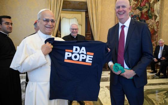 Pope Leo XIV receives a T-shirt that says, "Da Pope," from a member of a pilgrimage of labor union leaders from Chicago visiting the Vatican Oct. 9. (CNS/Vatican Media)