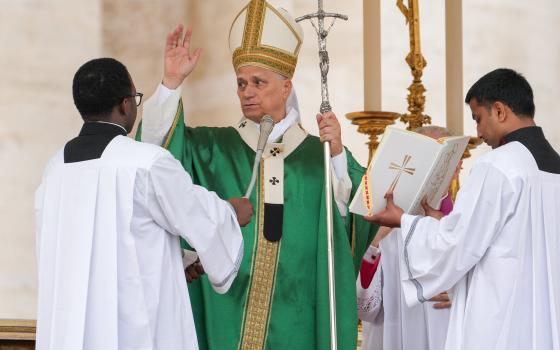 Pope Leo XIV gives his blessing at the conclusion of Mass for the Jubilee of Migrants and the Jubilee of the Missions in St. Peter’s Square at the Vatican Oct. 5, 2025. (CNS photo/Lola Gomez)