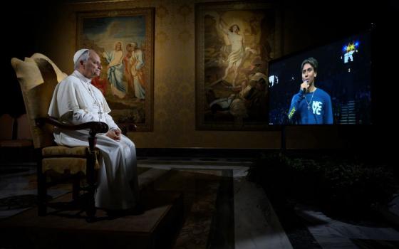 Pope Leo XIV listens to a question from Christopher Pantelakis from the Archdiocese of Las Vegas during a meeting livestreamed from the Vatican with 16,000 young people gathered at the National Catholic Youth Conference in Indianapolis Nov. 21. (CNS/Vatican Media)