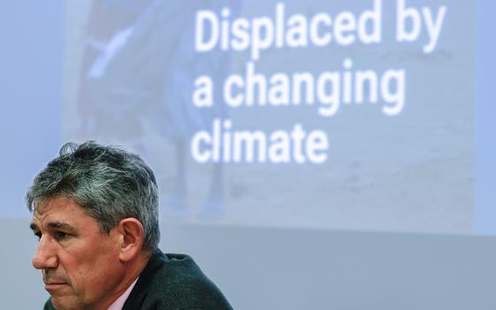 Alistair Dutton, Caritas Internationalis secretary general, reflects during a press conference in Rome Oct. 26, 2023, launching the organization's report on climate change and displacement. (CNS/Lola Gomez)