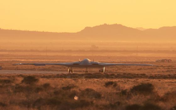 The U.S. Air Force's B-21 "Raider," the long-range stealth bomber that can be armed with nuclear weapons, rolls onto the runway at Northrop Grumman's site at Air Force Plant 42, during its first flight, in Palmdale, Calif., in this 2023 file photo. (OSV News/Reuters/David Swanson)