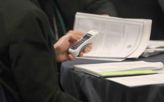 A bishop uses an electronic voting device during a Nov. 14, 2023, session of the fall general assembly of the U.S. Conference of Catholic Bishops in Baltimore. At the U.S. bishops' 2025 fall plenary in Baltimore, the bishops will vote to elect a new conference president. (OSV News/Bob Roller)