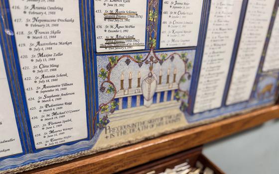 The necrology board at Mount St. Scholastica in Atchison, Kansas, lists the names and dates of sisters who have gone before, a daily reminder for the community to carry them in prayer. (GSR photo/Helga Leija)