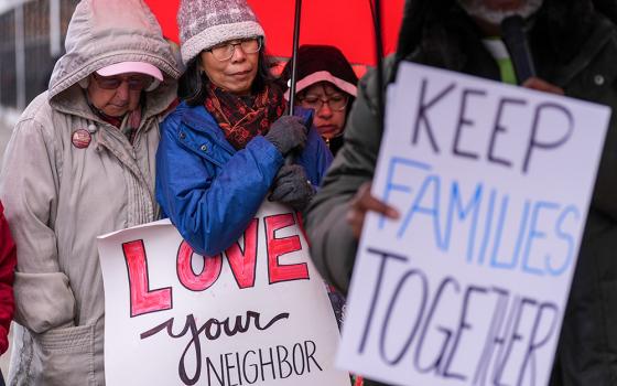 Mercy Sr. May Cronin, left, and Missionary Servant of the Most Blessed Trinity Sr. Christine Ma participate in a prayer vigil near the U.S. Immigration and Customs Enforcement Field Office Nov. 19, 2025, in Philadelphia. (AP/Matt Slocum)
