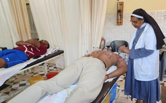 Sr. Valentine Cota assists physiotherapist Dr. Sneha Dargalkar at the Fr. Faustino Charitable Clinic and Physiotherapy Center, run by the Holy Family Sisters in Sancoale, Goa, India. (Courtesy of Molly Fernades)