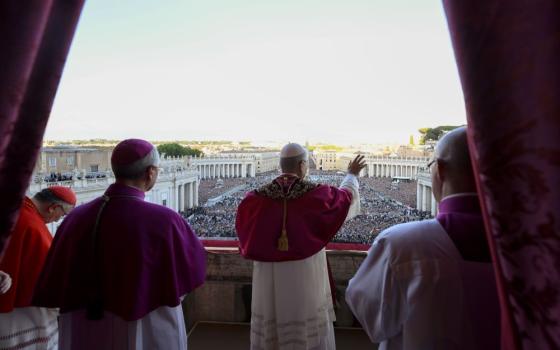 Pope Leo XIV, the former Cardinal Robert Francis Prevost, waves after walking onto the central balcony of St. Peter's Basilica at the Vatican May 8, following his election during the conclave. The first U.S.-born pope and the first Augustinian pope in history, Leo's first public words were "Peace be with you!" (OSV News/Vatican Media)