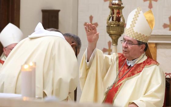 Cardinal Christophe Pierre, papal nuncio to the United States, blesses Deacon Robert Cousar before he reads the Gospel during the Raskob Foundation Family Mass at St. Joseph Church in Wilmington, Del., Sept 20, 2025. (OSV News/The Dialog/Don Blake)