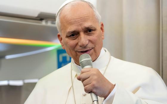 Pope Leo XIV answers a question from a journalist aboard his flight back to Rome from Lebanon, Dec. 2, 2025. (CNS/Lola Gomez)