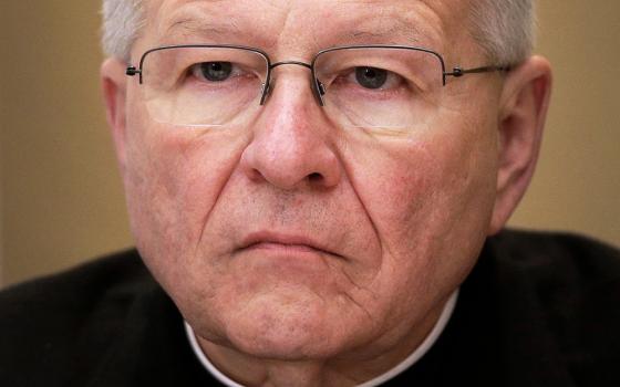 Archbishop Gregory Aymond, of New Orleans, listens during a news conference at the United States Conference of Catholic Bishops' annual fall meeting in Baltimore, Nov. 12, 2013. (AP Photo/Patrick Semansky, File)