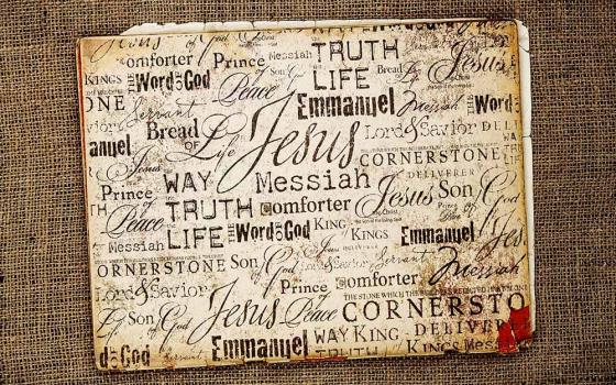 A collection of words for Jesus in different fonts, on a burlap background (Dreamstime/Genotar)